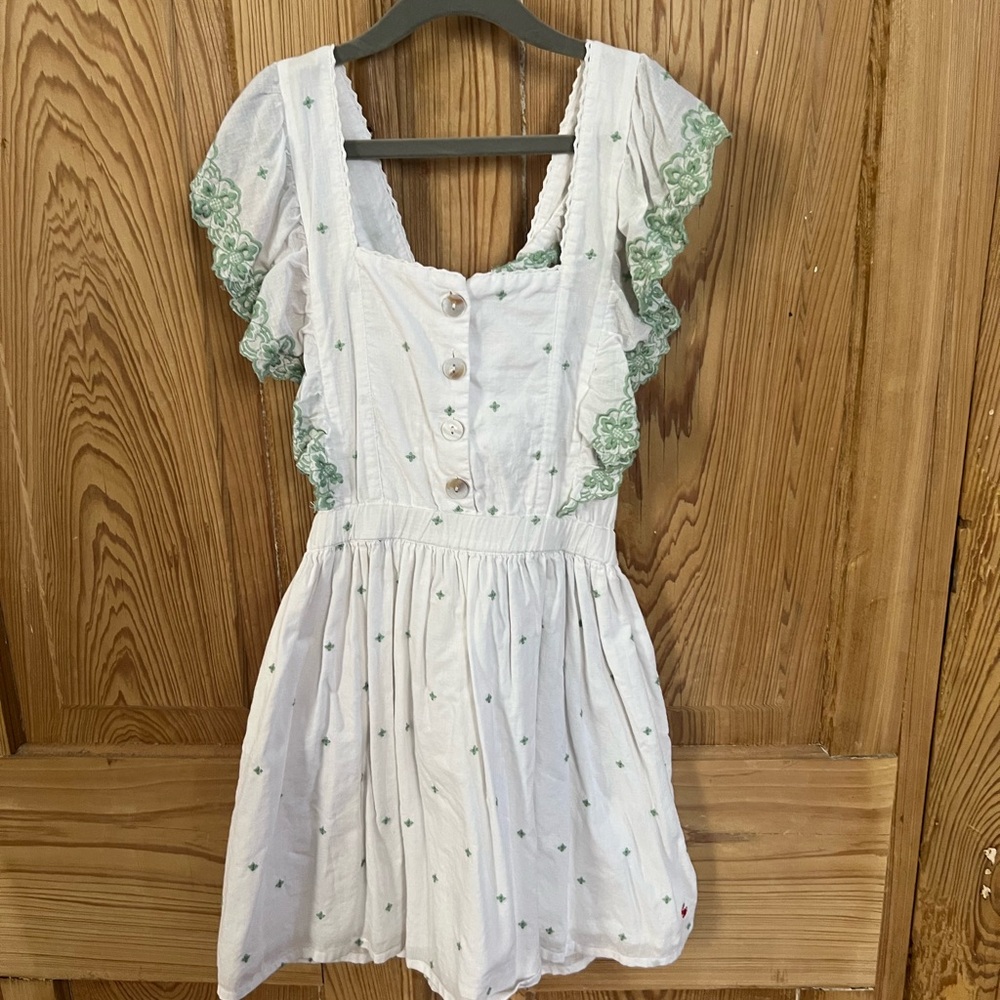 Charming White Dress with Green Lace Accents